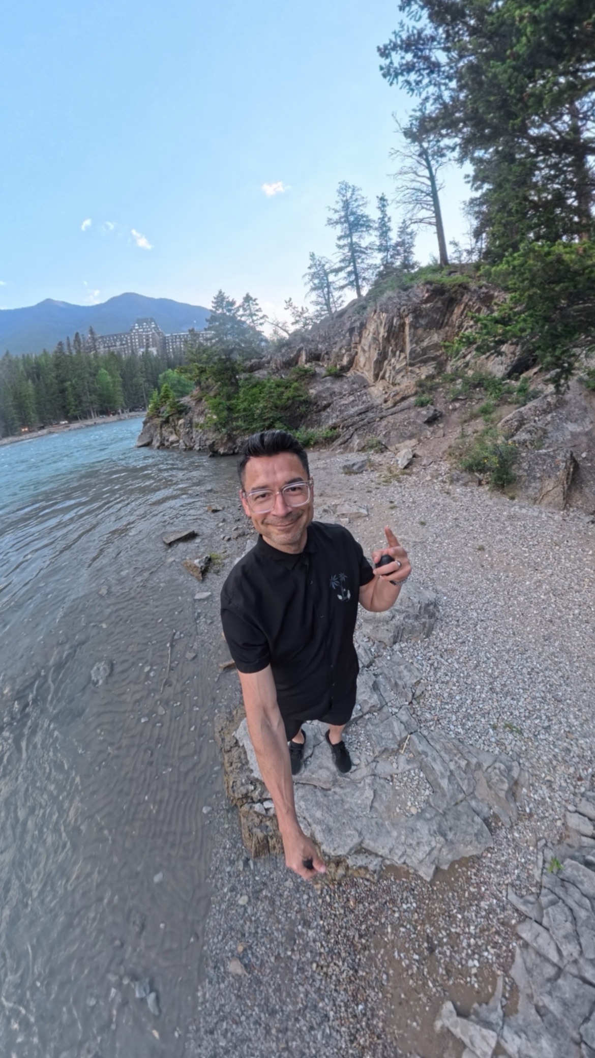Javier at the lakeshore with the Fairmont Banff Springs behind him