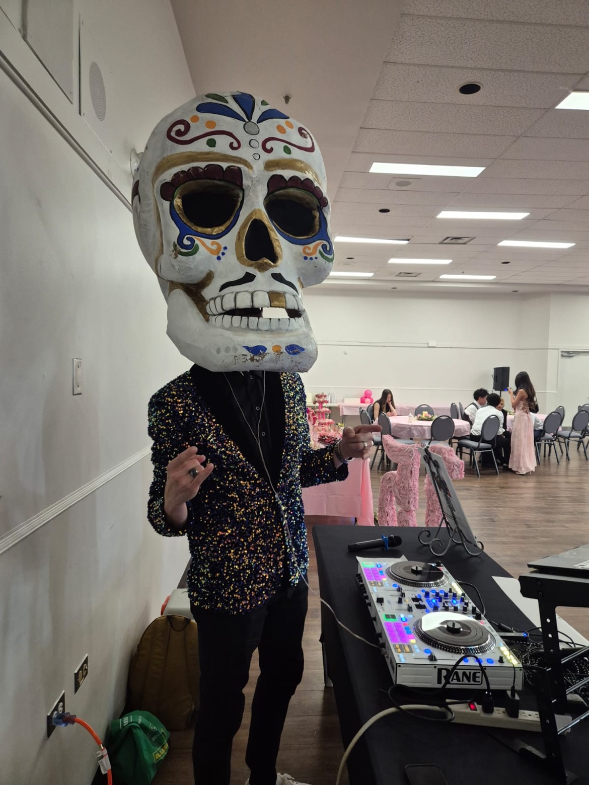 Javier as a calavera DJ at an event with a Rane controller