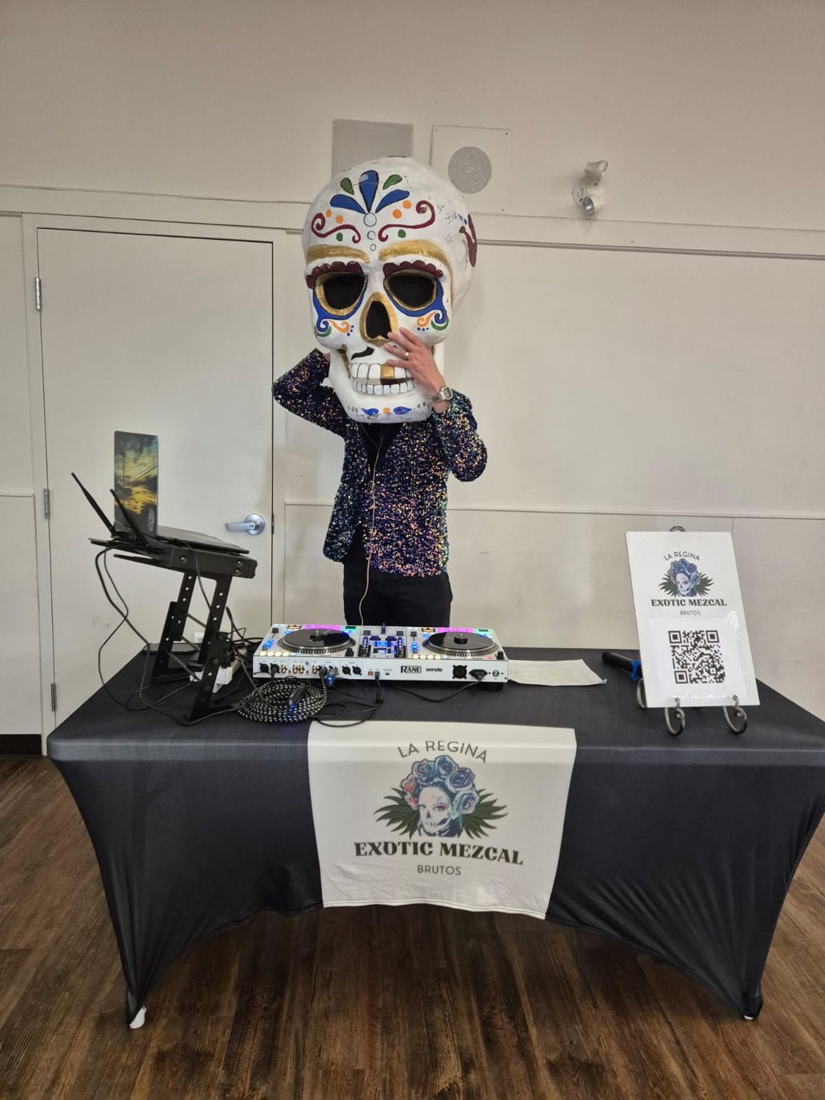 The calavera DJ behind the La Regina Exotic Mezcal Brutos table